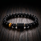 Virgo zodiac bracelet on dark wood with black beads and tiger eye stone for natural earthy style and gifting appeal