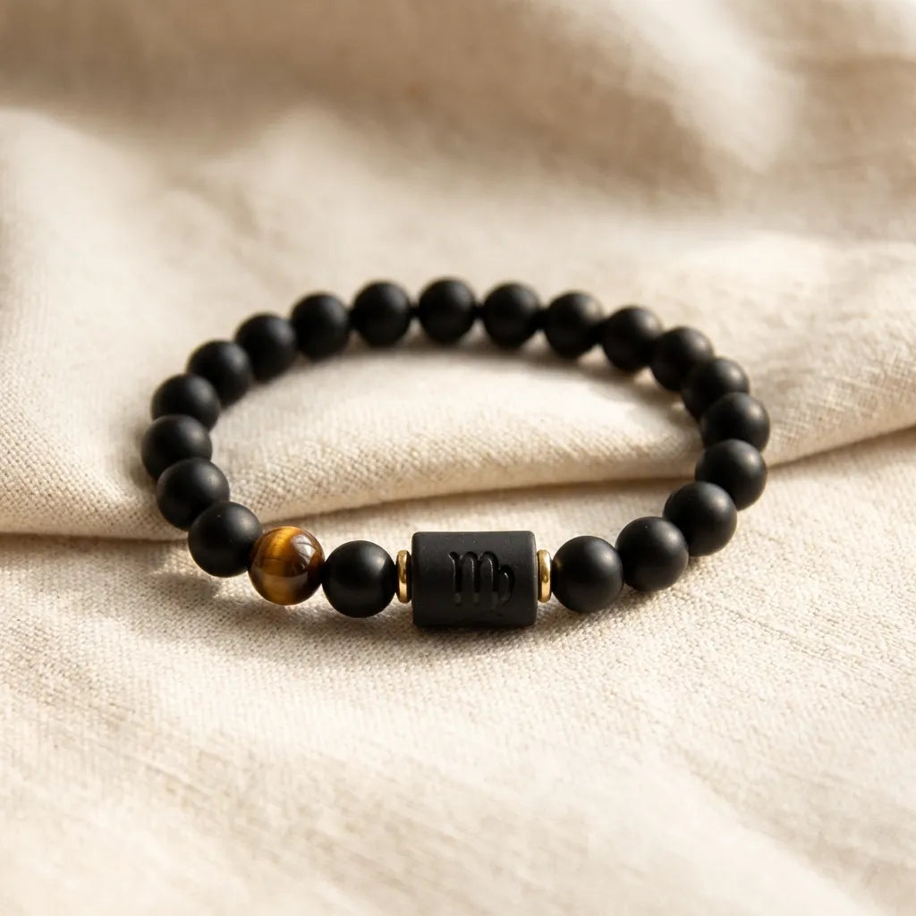 Virgo zodiac bracelet on soft beige fabric with black beads and tiger eye stone for calm minimalist aesthetic gift appeal