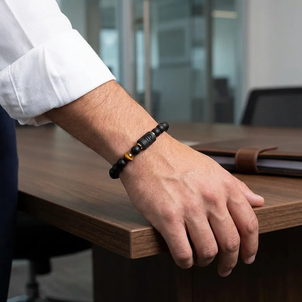 Virgo zodiac bracelet styled in office setting with black beads and tiger eye detail for polished business look appeal