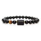 Virgo zodiac bracelet isolated on white with black beads and tiger eye detail for clean high conversion product display