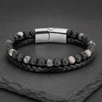 Volcanic Rock Larvikite bracelet on slate display with braided leather and lava beads creates bold appeal