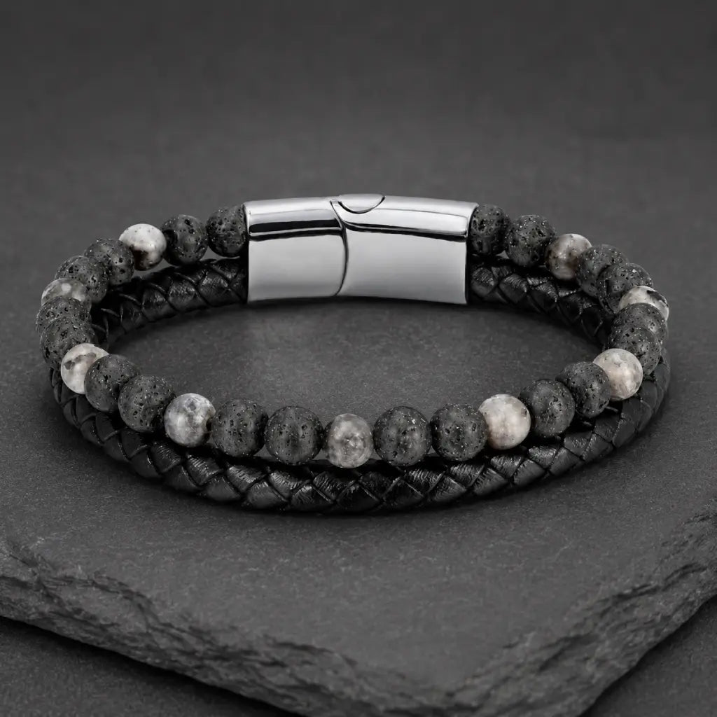 Volcanic Rock Larvikite bracelet on slate display with braided leather and lava beads creates bold appeal
