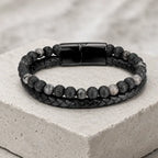 Volcanic Rock Larvikite bracelet on stone platform with braided leather and natural beads creates sleek appeal