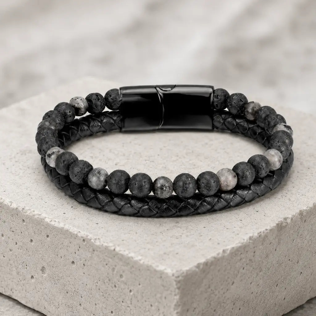 Volcanic Rock Larvikite bracelet on stone platform with braided leather and natural beads creates sleek appeal