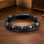 Volcanic Rock Larvikite bracelet displayed on wood surface with braided leather and natural stone beads for style