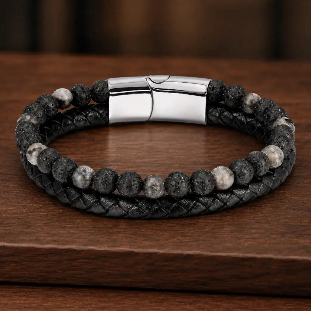 Volcanic Rock Larvikite bracelet on wooden display with braided leather and textured stone beads for appeal