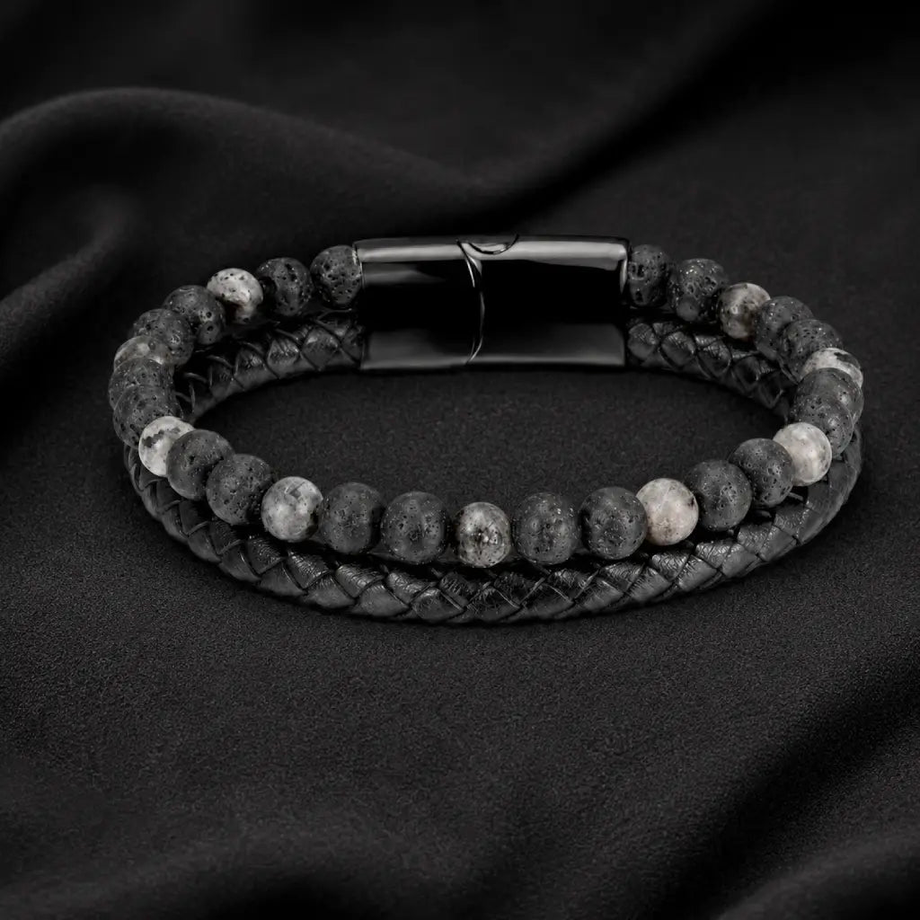 Volcanic Rock Larvikite bracelet on dark fabric background with braided leather and lava beads for bold appeal