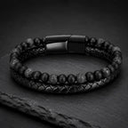 Volcanic Rock bracelet with braided leather and black lava beads on slate display for luxury appeal