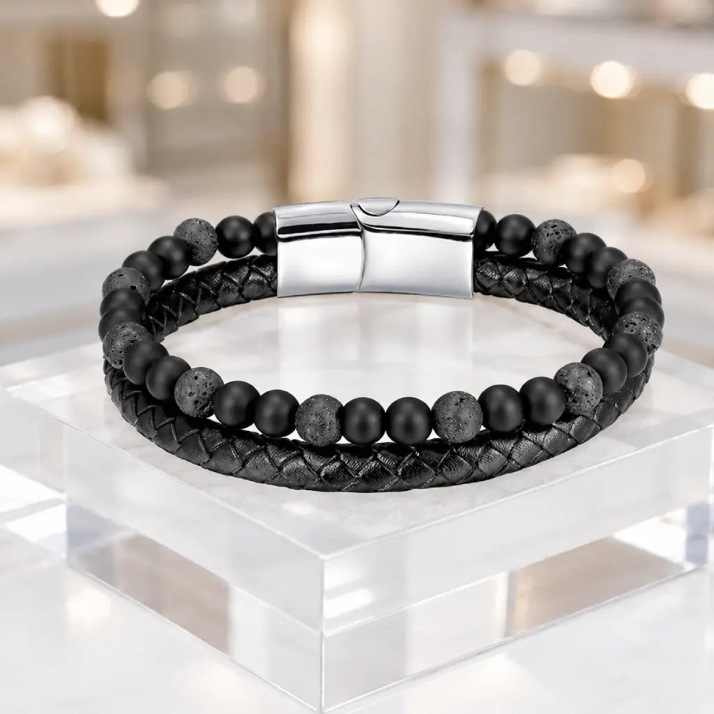 Volcanic Rock bracelet with lava stone beads and braided leather in luxury display for premium style
