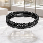Volcanic Rock bracelet with matte beads and braided leather featuring sleek black clasp for bold style