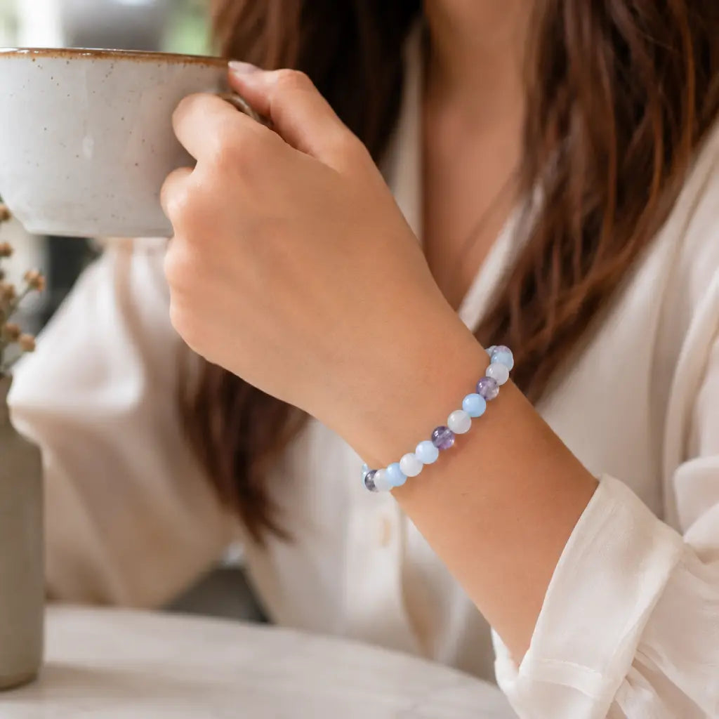 whitemoon stone-aquamarine bracelet beside tea with healing crystal jewelry for calming everyday comfort