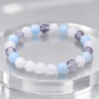 whitemoon stone-aquamarine bracelet displayed on mirrored surface with premium crystal jewelry appeal