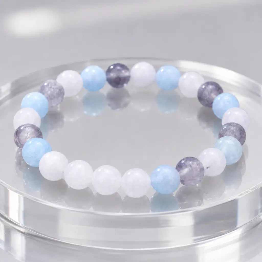 whitemoon stone-aquamarine bracelet displayed on mirrored surface with premium crystal jewelry appeal