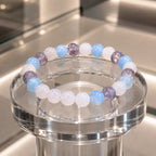 whitemoon stone-aquamarine bracelet showcased on glass display with elegant gemstone jewelry styling
