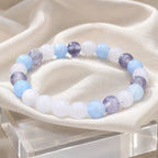 whitemoon stone-aquamarine bracelet displayed on soft fabric with gemstone jewelry for refined styling