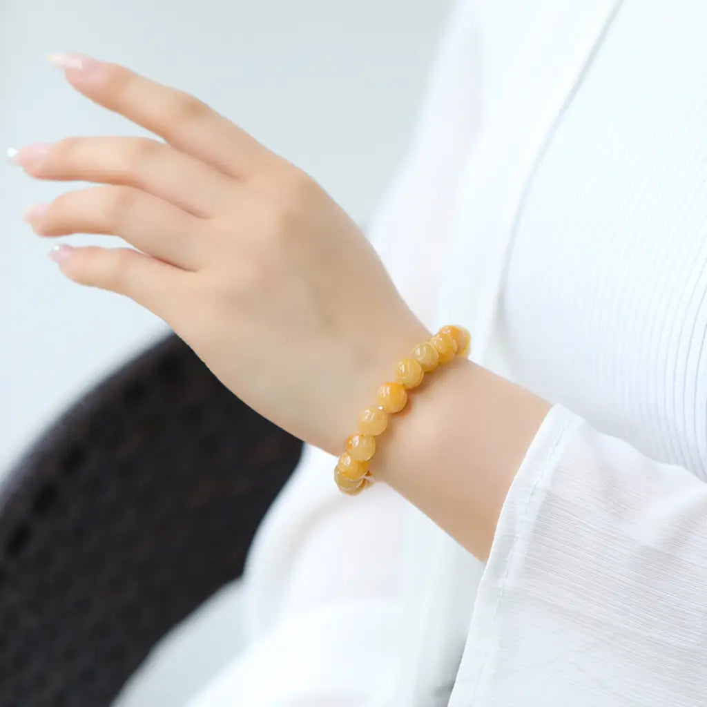 Yellow jade quartz bracelet worn on wrist featuring healing crystal beads and stylish everyday comfort appeal