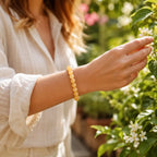Yellow jade quartz bracelet worn outdoors with natural crystal beads for stylish and calming daily wear