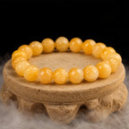 Yellow jade quartz gemstone bracelet on textured display featuring healing crystal beads for premium style