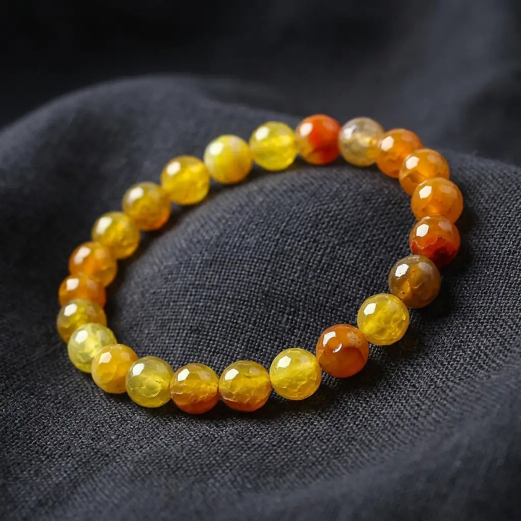 Yellow popcorn agate bracelet bright honey beads on dark fabric, warm crystal jewelry for confident everyday energy