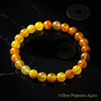 Yellow popcorn agate bracelet golden faceted beads with antique coins on black marble, lucky gemstone jewelry gift