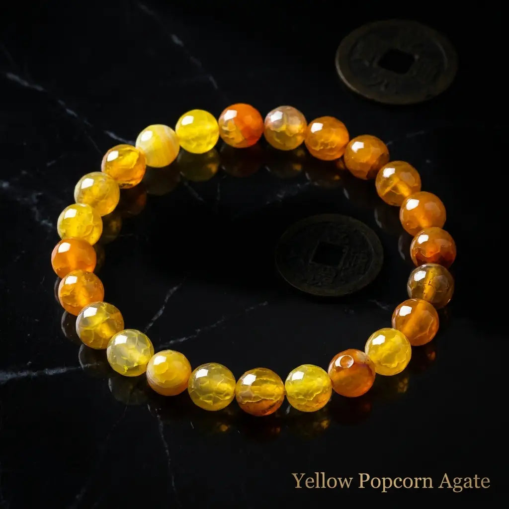 Yellow popcorn agate bracelet golden faceted beads with antique coins on black marble, lucky gemstone jewelry gift
