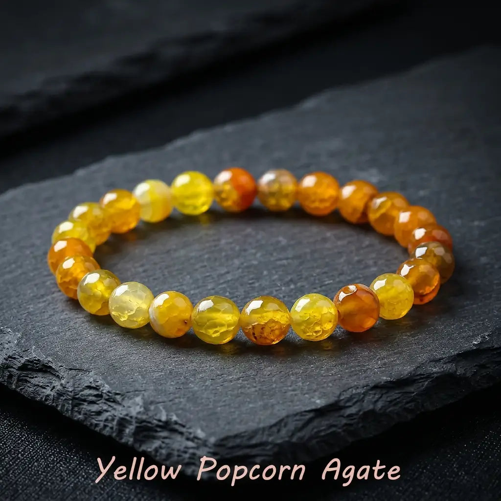 Yellow popcorn agate bracelet glowing yellow orange beads on black slate, bold crystal jewelry for standout gift appeal