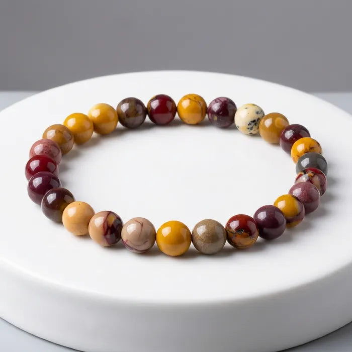 Yolk Stone Bracelet with multicolor polished beads on clean white surface, minimalist crystal jewelry for elegant everyday wear