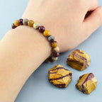 Yolk Stone Bracelet close-up on wrist with natural beads and raw stones, earthy crystal jewelry for grounding energy