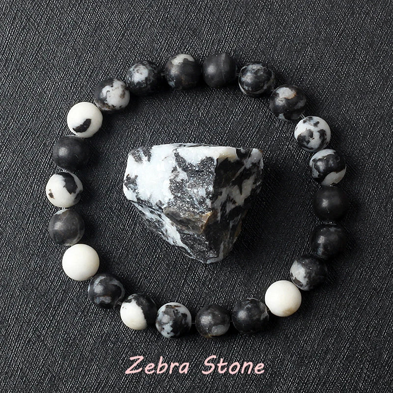 Zebra stone bracelet with a large zebra stone on a dark textured background